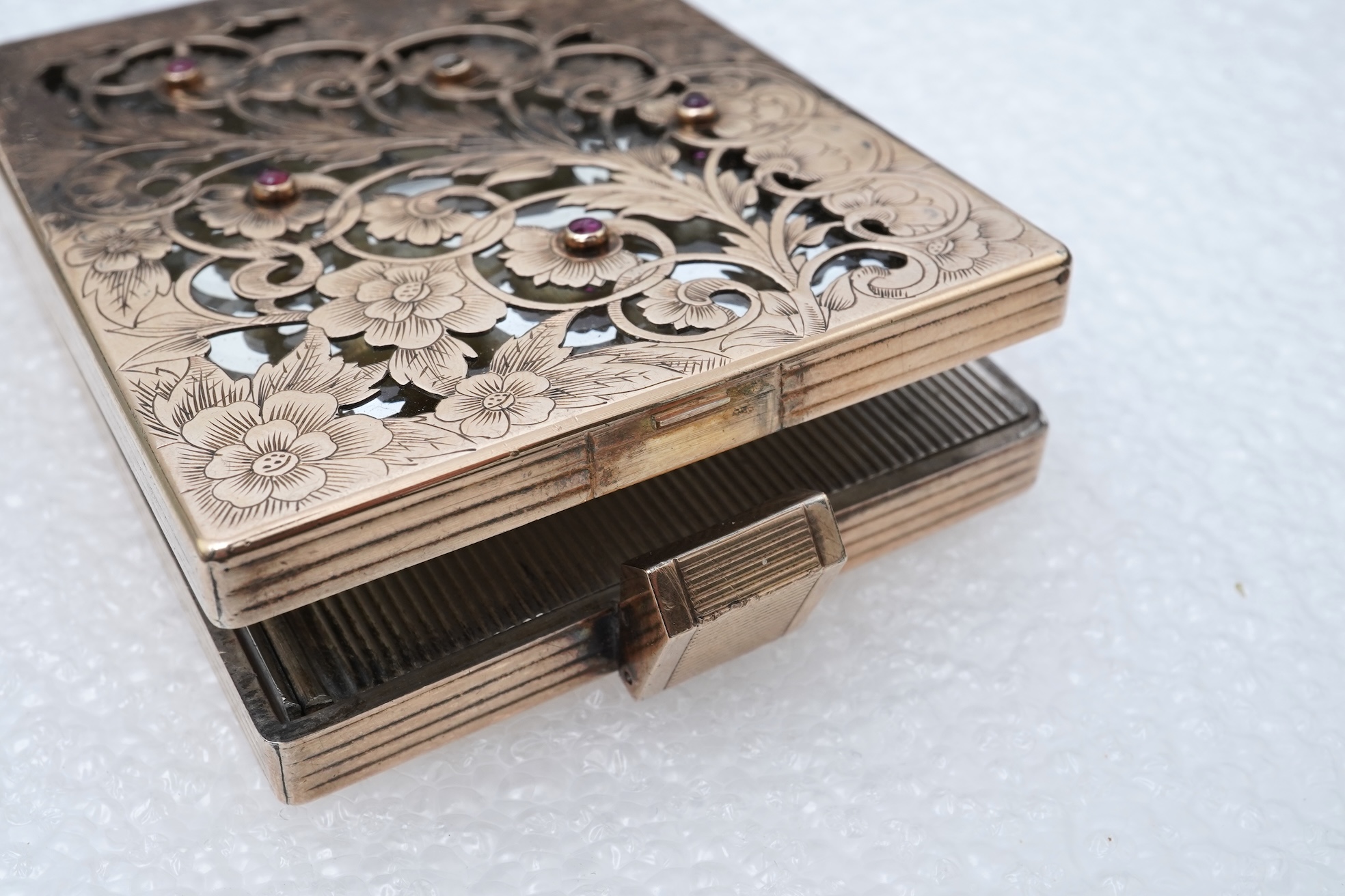 Boucheron, a silver gilt and ruby vanity case, France, 1940s